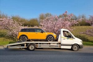 Breakdown recovery in London — Mini on a flatbed tow truck