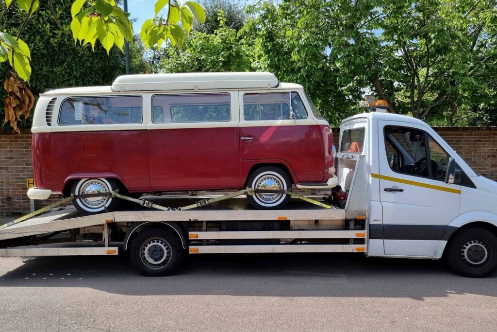 Flatbed towing service London transporting a classic VW camper van safely secured
