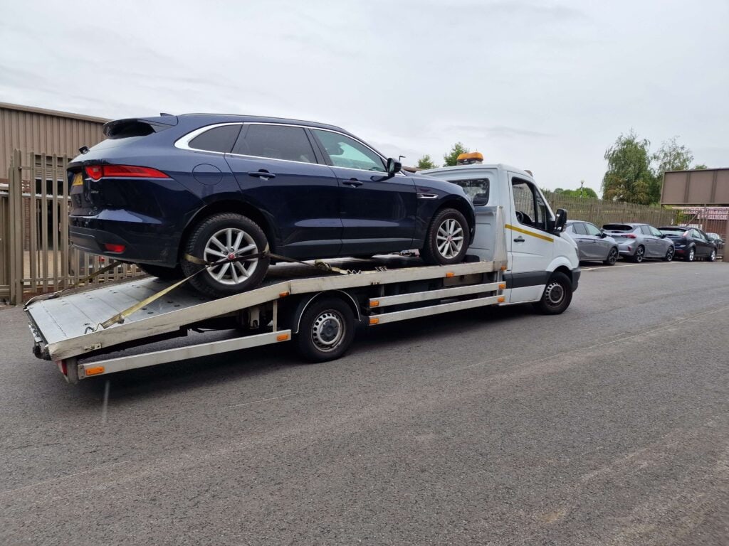 24 hour car recovery and towing service using flatbed tow truck