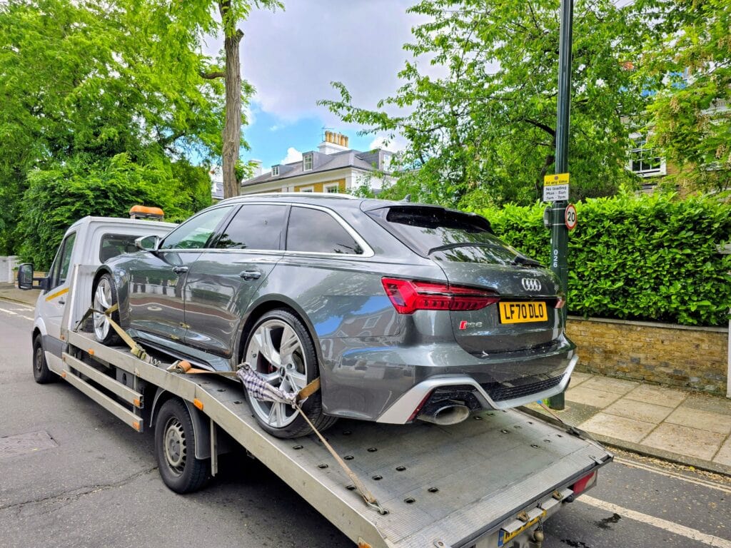 Audi RS6 loaded on flatbed tow truck — high performance car recovery London by London Auto Towing