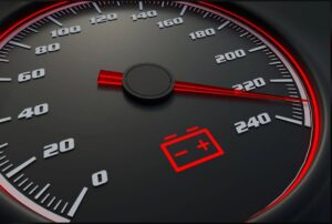Battery warning light illuminated on the dashboard during an electric car jump start and 12-volt support visit in London.