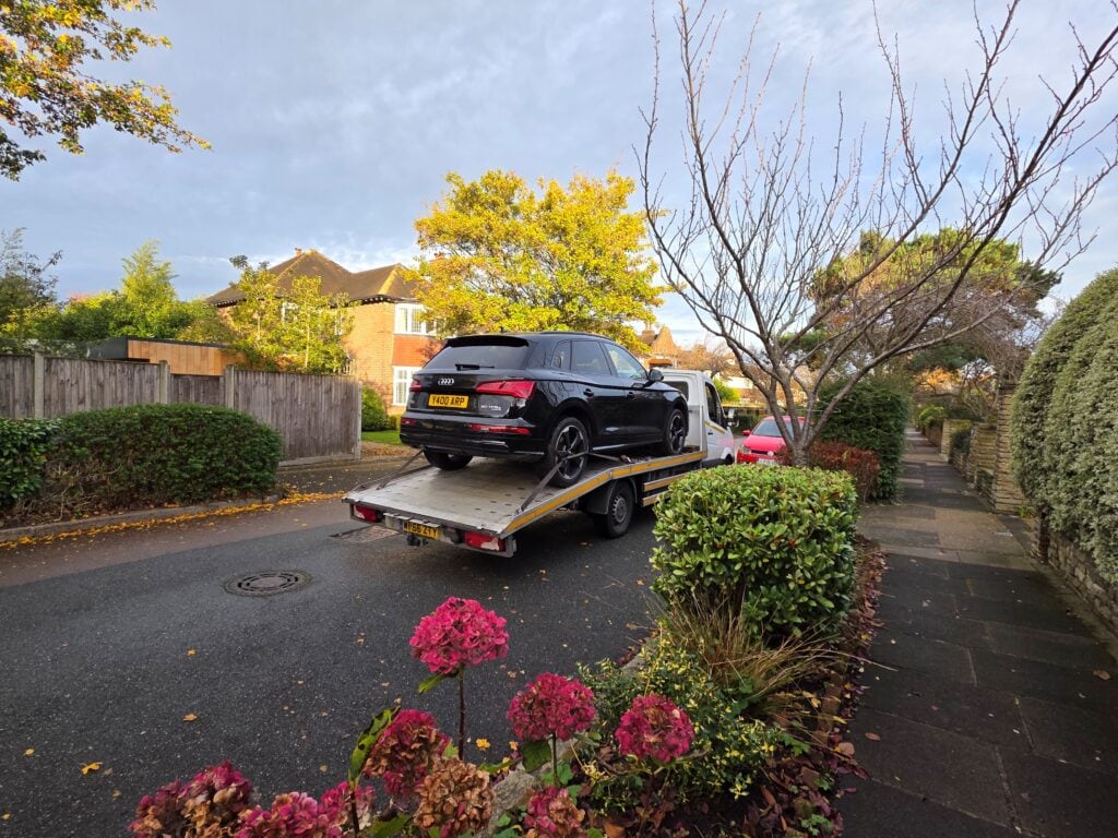 Audi Q5 Hybrid recovered on flatbed tow truck by London Auto Towing – local car recovery & towing service