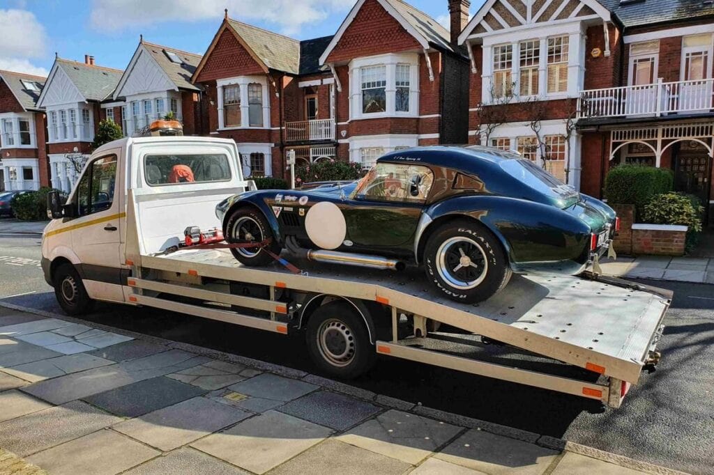 Emergency car recovery with winch and flatbed towing service
