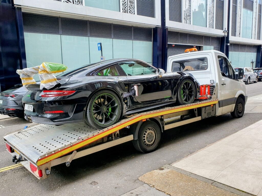 High value car recovery with controlled flatbed towing service in London
