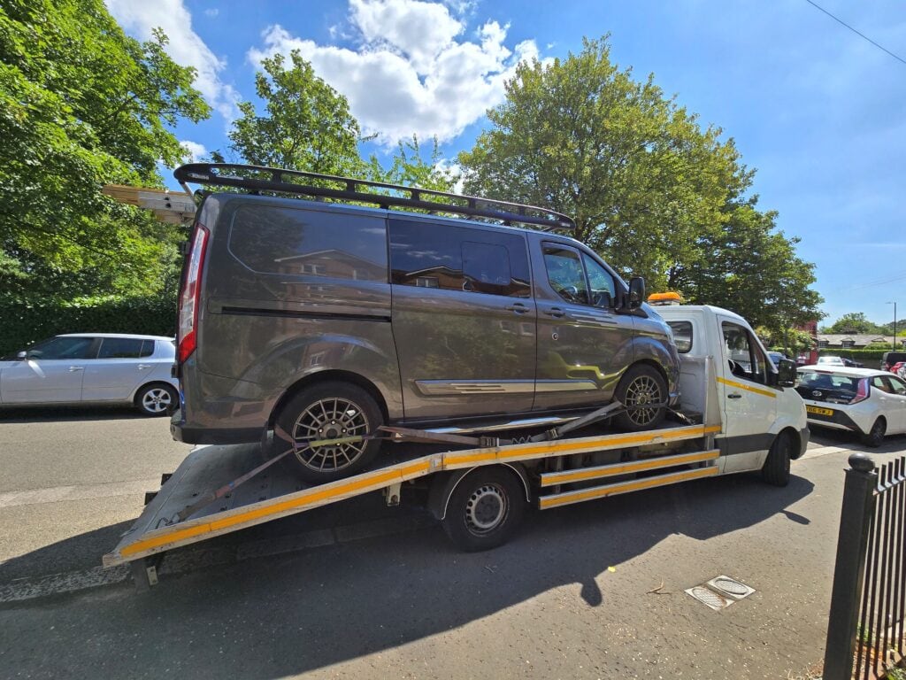 Light commercial van recovery on flatbed tow truck by London Auto Towing
