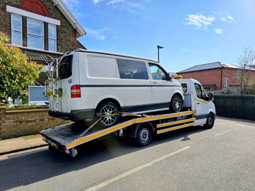 van recovery service London — VW Transporter secured on flatbed recovery truck