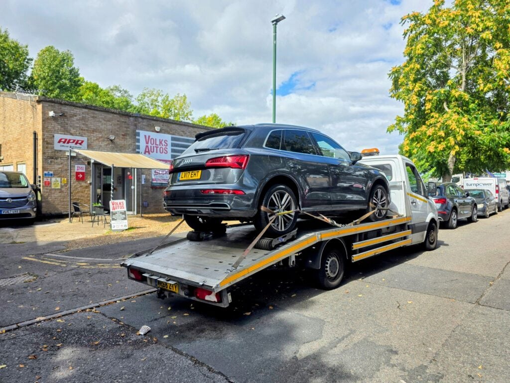Audi Q5 non-runner with DSG automatic gearbox failure secured on a flatbed tow truck for vehicle recovery