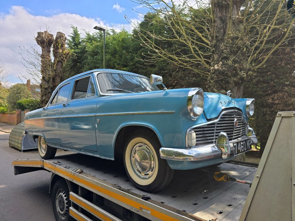 Ford Zodiac saloon secured on a flatbed tow truck for specialist classic car recovery in London and Surrey