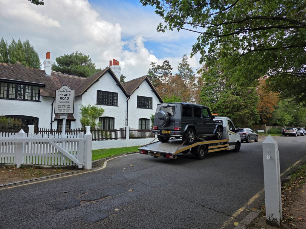 High value Mercedes G-Class secured on our flatbed tow truck during controlled high value car recovery on a private London estate road.