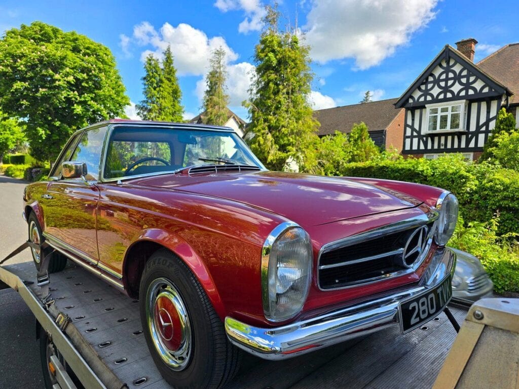 Classic Mercedes Benz 280 SL Pagoda secured on our flatbed tow truck during controlled high value car recovery for Mercedes specialist Colin Ferns in Richmond.