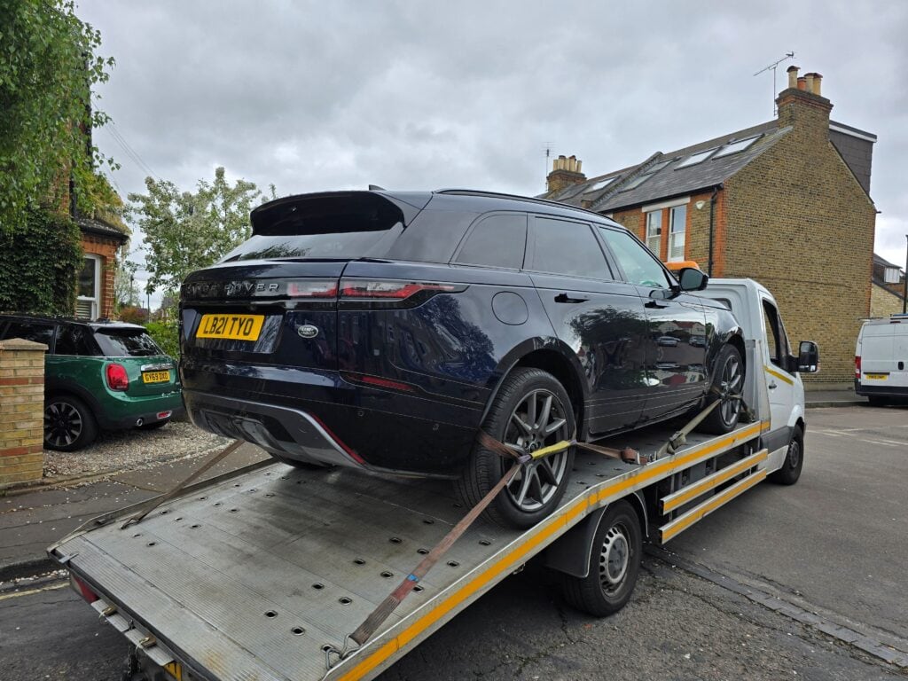Range Rover Velar plug-in hybrid recovered on a flatbed recovery truck as part of a 24 hour car recovery service in London