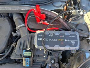 Professional car battery jump start service Richmond using a NOCO Boost Pro jump pack and TOPDON battery tester.