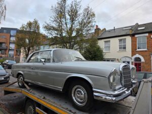Classic Mercedes secured on flatbed tow truck during high value car recovery Richmond specialist service