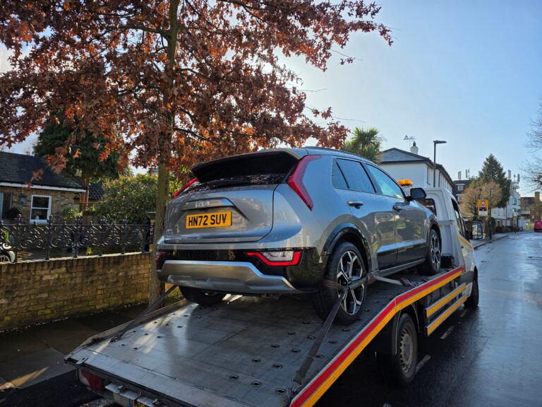 car recovery richmond breakdown recovery kia SUV secured on flatbed tow truck later sold to local family