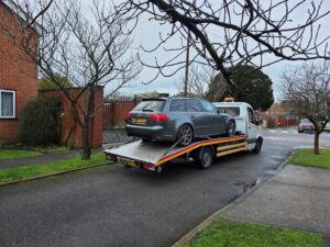 Emergency car recovery Richmond service loading a grey Audi S4 estate onto a flatbed recovery truck