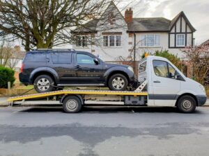 24/7 breakdown recovery Twickenham loading Nissan Pathfinder onto flatbed recovery truck