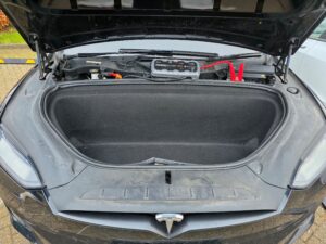 Professional car battery jump start service in Twickenham featuring a NOCO Boost Pro jump pack connected to a black Tesla Model X.