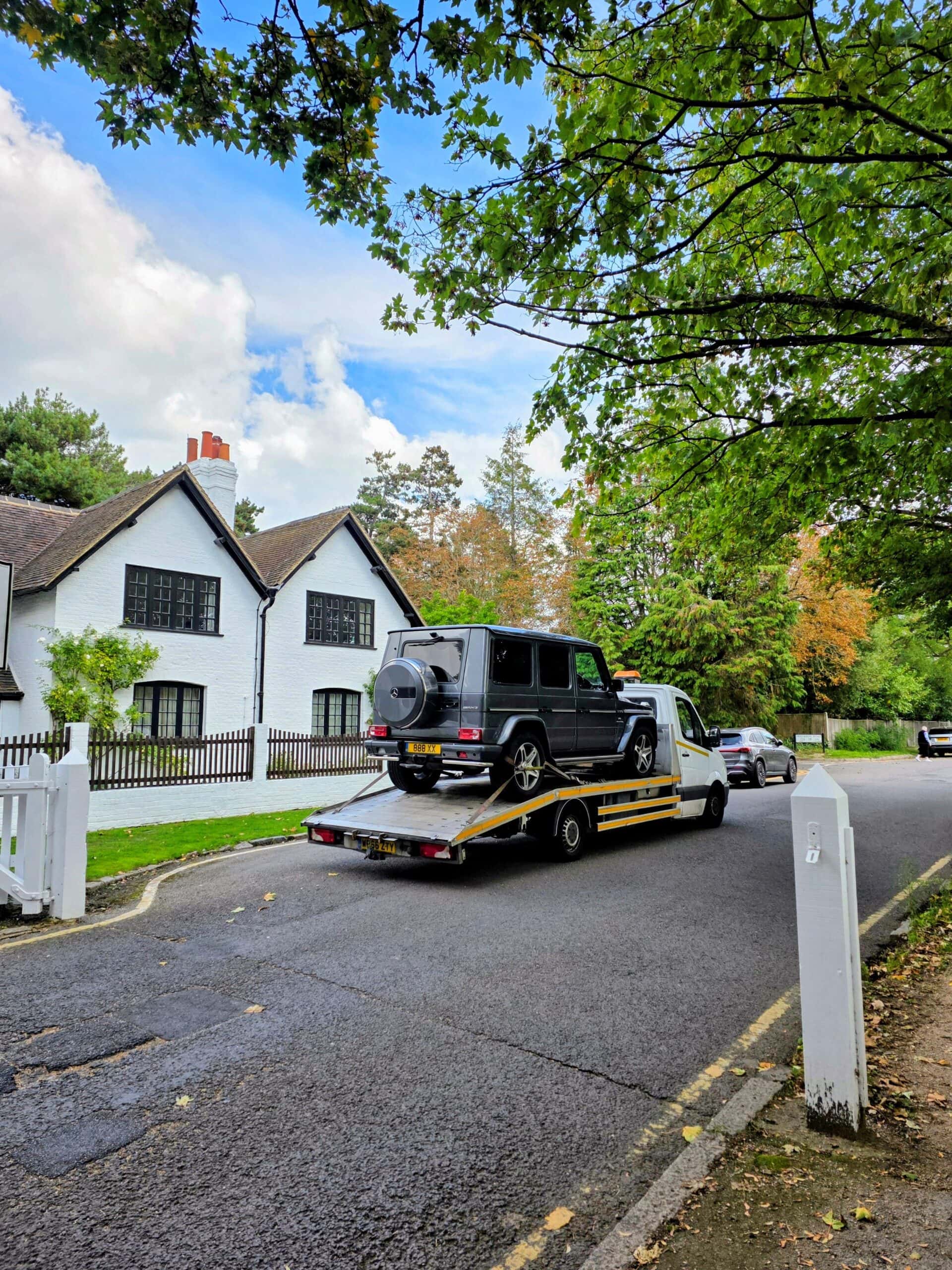car recovery Kingston Mercedes G-Class secured on flatbed recovery truck in residential street
