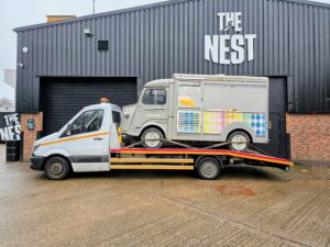 Vintage Citroen H food truck on flatbed recovery truck for professional commercial van recovery Kingston.