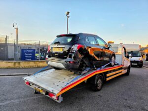 Vauxhall Mokka release from Perivale pound for a professional police compound recovery Wimbledon service using a flatbed truck.