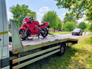 Honda VFR800 motorcycle on a flatbed tow truck for professional motorbike recovery Wimbledon service in SW19.