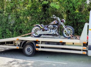 Custom Harley-Davidson chopper on a flatbed recovery truck for professional motorcycle recovery Fulham service in the SW6 area.