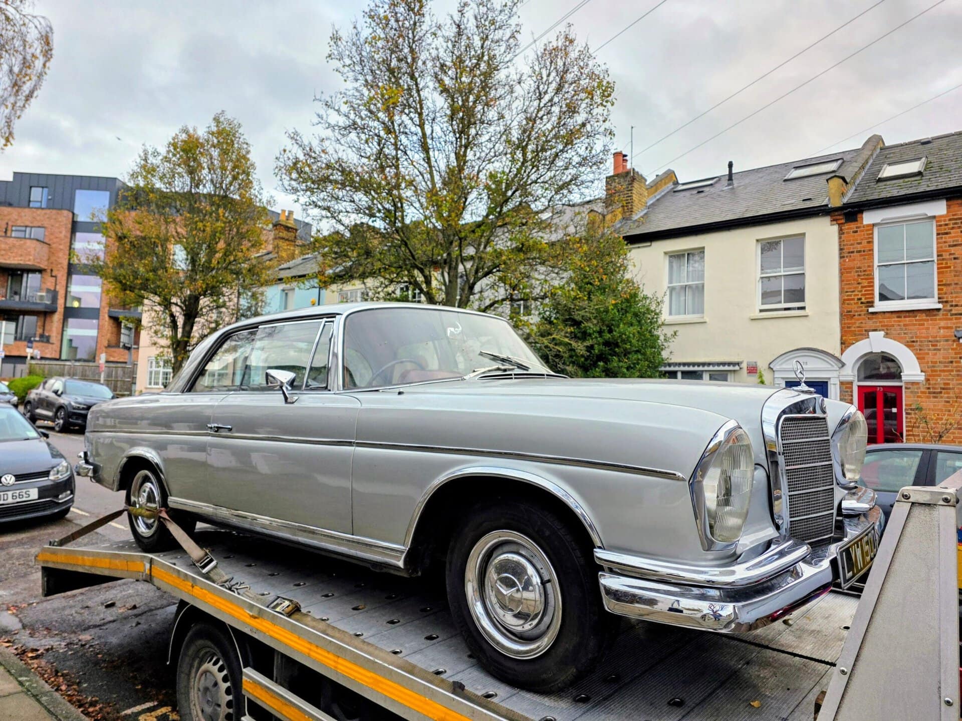Mercedes-Benz 280SE on a flatbed tow truck for breakdown recovery Kensington. 20 years of expert local service.