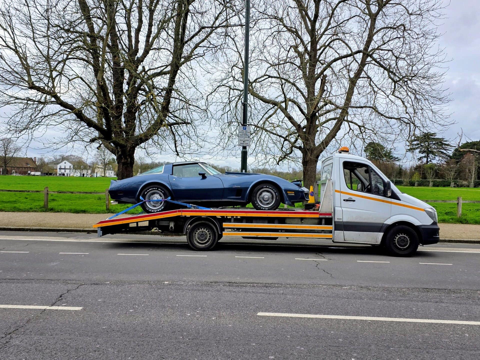 Chevrolet Corvette C3 Stingray on a flatbed tow truck during a professional classic car recovery Kensington service in W8.