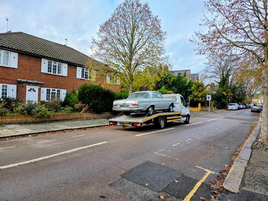 Car recovery Chiswick W4 with flatbed towing service transporting a classic Mercedes in West London