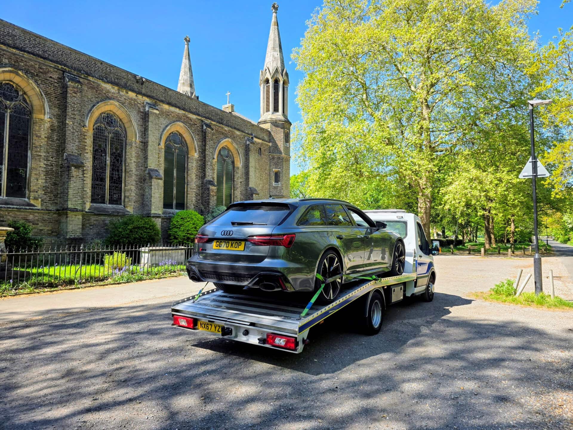 Audi RS6 loaded on flatbed tow truck for car recovery Chiswick by London Auto Towing W4