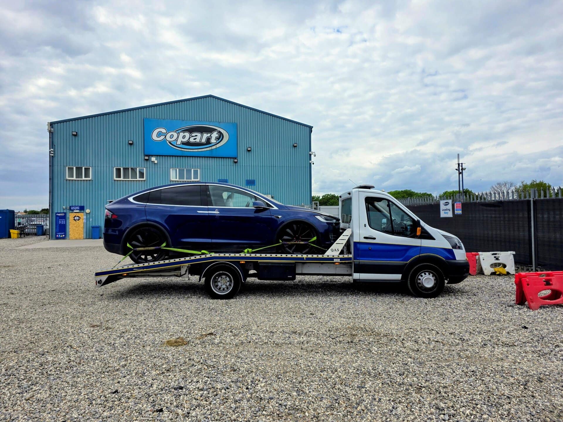Tesla Model X on flatbed tow truck — specialist electric car recovery service Chiswick London Auto Towing